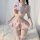 Woman wearing pink sexy nurse costume with heart emblem, ruffled skirt, and lace trim—plus size role play lingerie set.