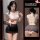 Woman modeling a sexy ol secretary costume lingerie set, featuring a white cutout top and black bodycon mini skirt.