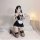 Woman kneeling in black and white sexy plus size maid costume set with lace trim, garters, and apron for seductive lingerie s...