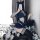 Woman posing in sexy police uniform lingerie set with skirt, thigh-highs, and cat ears—perfect for role play costumes.
