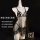 Sheer black lace bodysuit with butterfly cutouts and floral trim on a mannequin.