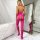 Woman wearing pink floral lace bodystocking with bows, back view in elegant room setting.