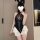 Sexy black pvc bunny bodysuit with mesh ties, white ruffle skirt, and rabbit ears. open-front latex-inspired erotic costume.