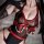 Sexy seamless lingerie bodysuit featuring sheer tight mesh tank top with red leather harness and pearl accents, perfect for w...