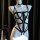 Sexy black strappy bodysuit with chains and choker for bondage role play.