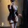 Woman in black sexy secretary costume with cutout bodysuit, thigh-highs, and blazer for role play and lingerie.