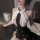 Woman modeling sexy secretary costume set with white sheer halter top and black mini skirt for role play.