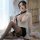 Woman in sheer white blouse, black pencil skirt, and stockings with tie, posing seductively for sexy secretary costume set – ...