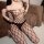 Woman wearing a sheer mesh bodysuit with fishnet pattern and open-crotch design, part of the sexy secretary costume set for a...