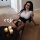 Woman in sexy secretary outfit set with tight bodycon lingerie, seductive office-themed costume for adults, posing on floor w...