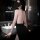 Woman wearing a sexy sheer halter bodycon dress with a seductive backless design, perfect for secretarial or sleepwear looks.