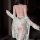 Woman wearing backless sheer lace bodysuit with open crotch and hook-and-eye closure, paired with matching robe.
