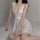 Woman wearing sexy sheer lace sleepwear with back slit, flirty mesh nightgown for breathable bedroom lingerie.