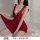 Woman wearing red sheer lace sleepwear with back slit, flirty mesh nightgown for bedroom lingerie.