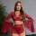 Woman modeling red lace lingerie set with deep v, flared sleeves, and detachable ties.