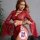 Woman modeling red sheer lace lingerie set with deep v, flared sleeves, and detachable ties — pure temptation sleepwear.