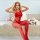 Woman wearing red sheer mesh bodysuit with single-shoulder design, open-crotch, and tight net bodycon fit.