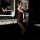 Woman wearing sexy sheer open-crotch bodysuit in modern bathroom – transparent lingerie outfit for seductive costume set.