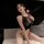 Woman wearing sexy sheer sleepwear bodysuit with lace detailing, designed for small bust, perfect as seductive bedtime linger...