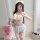 Woman modeling sexy sleepwear set with lace trim cami and shorts, floral sheer lingerie for women, holding teddy bear.