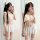 Woman modeling sexy sleepwear set with lace trim cami and shorts, floral sheer lingerie for women in mirror selfie.