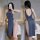 Woman modeling a backless, high-slit cheongsam lingerie dress in soft gray. sexy sleepwear with no-remove design for intimate...