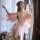 A woman models a delicate pink hanfu-inspired sleepwear set featuring an open-crotch design, perfect for intimate moments. th...