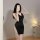 Woman wearing black deep v plunge sheath dress with sparkling side slit, elegant secretary costume outfit for night.
