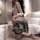 Woman in sexy student jk uniform set with lace bodysuit and sheer stockings, posing seductively on bed.