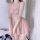 Woman wearing pink lace lingerie set with sheer nightgown, featuring delicate straps and bow detail, ideal for seductive slee...
