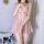 Woman wearing pink lace-trimmed transparent nightgown with bow detail, sheer fabric, and flowing hem — sexy lingerie set for ...