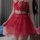 Woman wearing a red sexy uniform-inspired lingerie set with a no-remove bra and matching outfit, featuring intricate lace det...