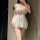 Woman wearing white lace lingerie set with push-up bra and sheer shorts, sexy uniform-inspired design for small bust and plus...
