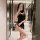 Woman taking mirror selfie in black satin qipao lingerie set with side-tie details and sheer panels, showcasing vintage chine...