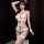 Sheer lace bodysuit with open-crotch design, black bows, and matching accessories for sensual sleepwear or date nights.
