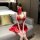 A woman poses wearing a vibrant red shimeisha chinese new year lingerie set, featuring intricate designs inspired by traditio...