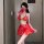 A woman poses wearing a vibrant red shimeisha chinese new year lingerie set, featuring intricate designs inspired by traditio...