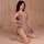 A woman poses in a shimmering sheer cheongsam lingerie set featuring a deep v-neckline and tie-back design, perfect for a sed...