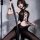A stylish black bodysuit set featuring a lace-up design, adjustable chain strap, and backless cutout, perfect for bold fashio...