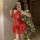 Woman wearing red shiny pu lace-up halter devil costume with batwing sleeves and sheer mini skirt for halloween.
