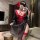 A woman poses in a black and red shuyao japanese-style lingerie set, featuring a no-remove design, perfect for roleplay and s...