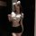 Woman wearing shuyao sexy ol secretary lingerie set with white top, black skirt, and cat ears in dimly lit room.