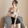 A woman poses in a black and white silk-look lace sheer secretary outfit, featuring a seductive hollow-out design, ruffled he...