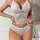 Woman modeling white lace lingerie set with cami top and shorts, elegant sleepwear for women.