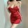 Woman wearing red silky sleep dress with side lace-up cutouts and thin straps, elegant nightwear for sensual allure.