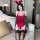 A woman poses in a red lace bodice with bunny ears, black stockings, and gloves, ideal for romantic nightwear.