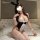 Woman wearing small-bust bunny girl costume set with lace bodysuit, thong, bunny ears, and white stockings on bed.