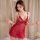 Woman wearing red sheer lace slip dress, small bust lingerie set with transparent fabric and delicate straps, elegant bedroom...