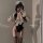 A woman poses in a black maid costume set featuring lace details, stockings, and a sailor hat, perfect for cosplay or themed ...