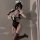 A woman poses in a black maid costume set featuring lace details, perfect for cosplay or themed events. includes sleepwear an...